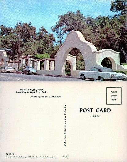 Arched Gateway to City Park with Cars