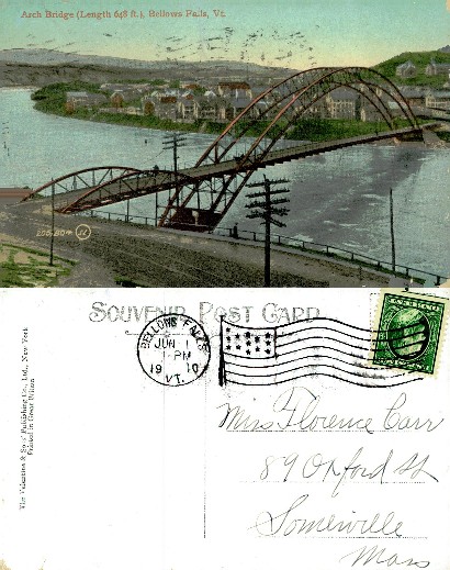 Arch Bridge over River with Town Scene