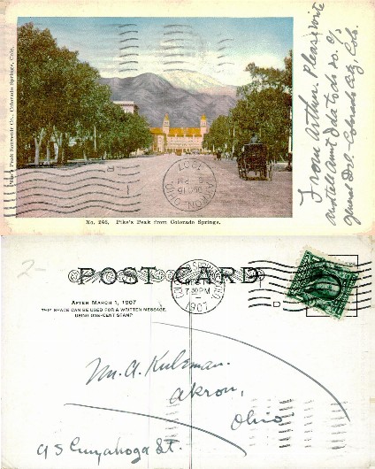 Street scene with large building and mountains