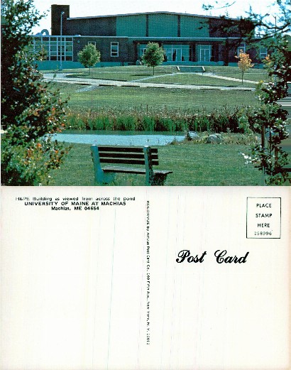 H&PE Building across a pond with bench