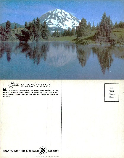 Snow-capped mountain reflecting in lake