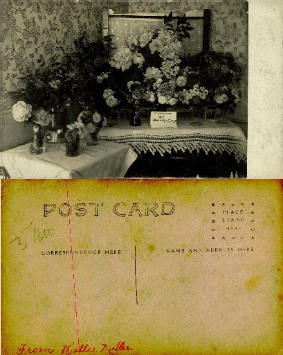Floral Arrangement with Compliments Sign
