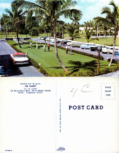 Hotel putting green with guests and cars