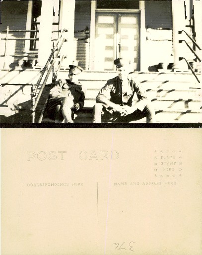 Two Men in Uniforms on Steps