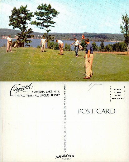 Golfers on a resort course by a lake