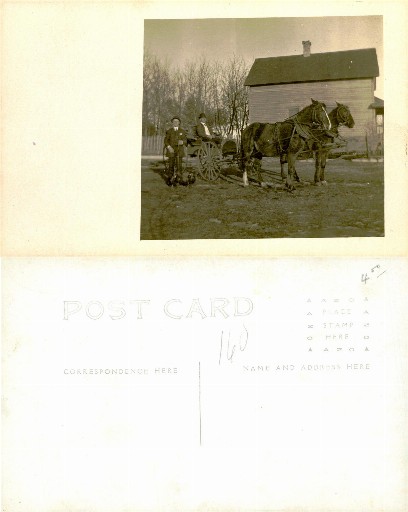 Men with Horses and Buggy by Building