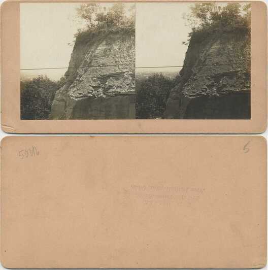 Rocky Cliff View with Distant Town