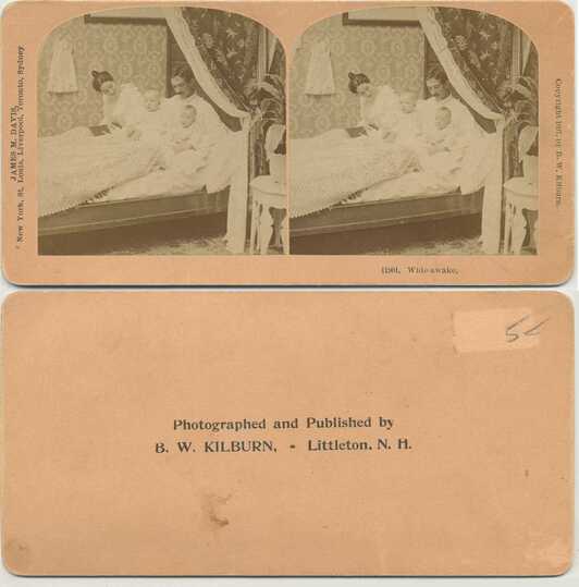 Family with Two Babies in Bed