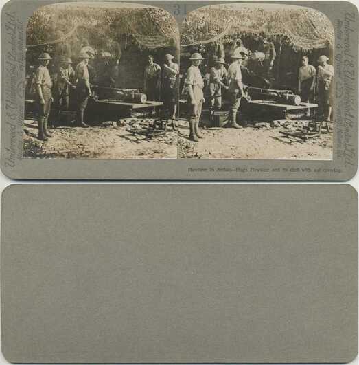 Soldiers with Camouflaged Howitzer