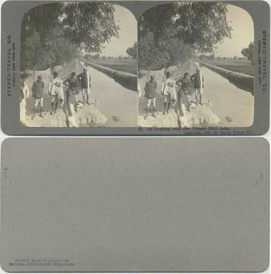 Irrigating canal with people in India