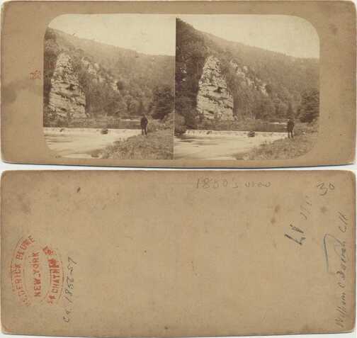 Rock Formation by River with Man