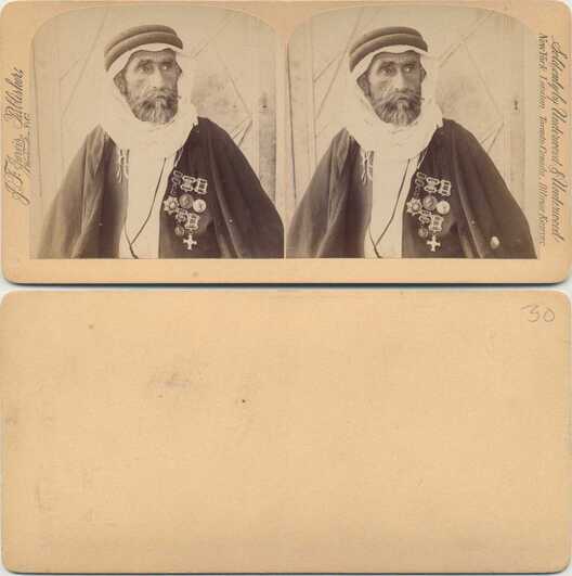 Man in headdress with medals