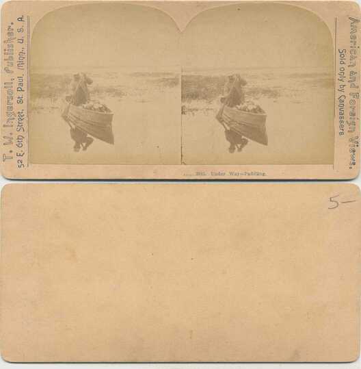 Paddler in boat in marsh