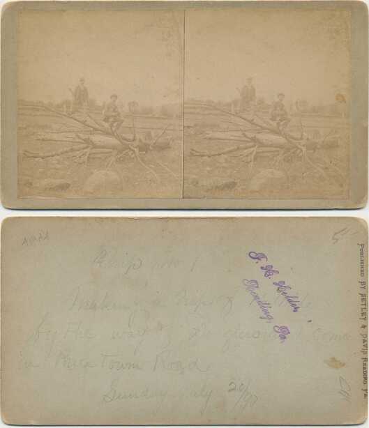 Two Men with Rifle and Logs