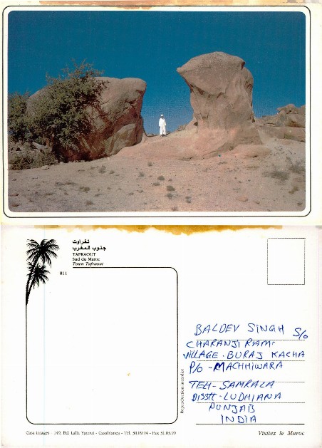 Man among desert rock formations