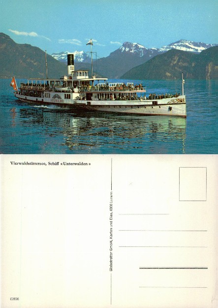 Steamboat on a lake with mountains