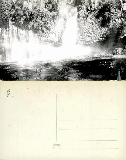 Waterfall between rock cliffs
