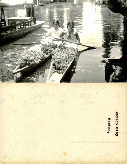 Two women in boat with flowers