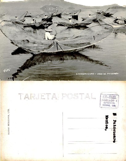 Fishermen with butterfly nets on lake